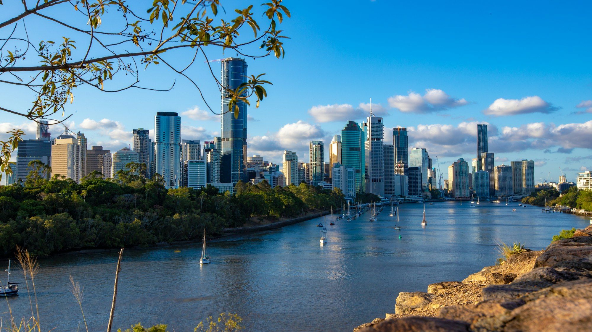Brisbane city high-rise buildings along the Brisbane River on a sunny day