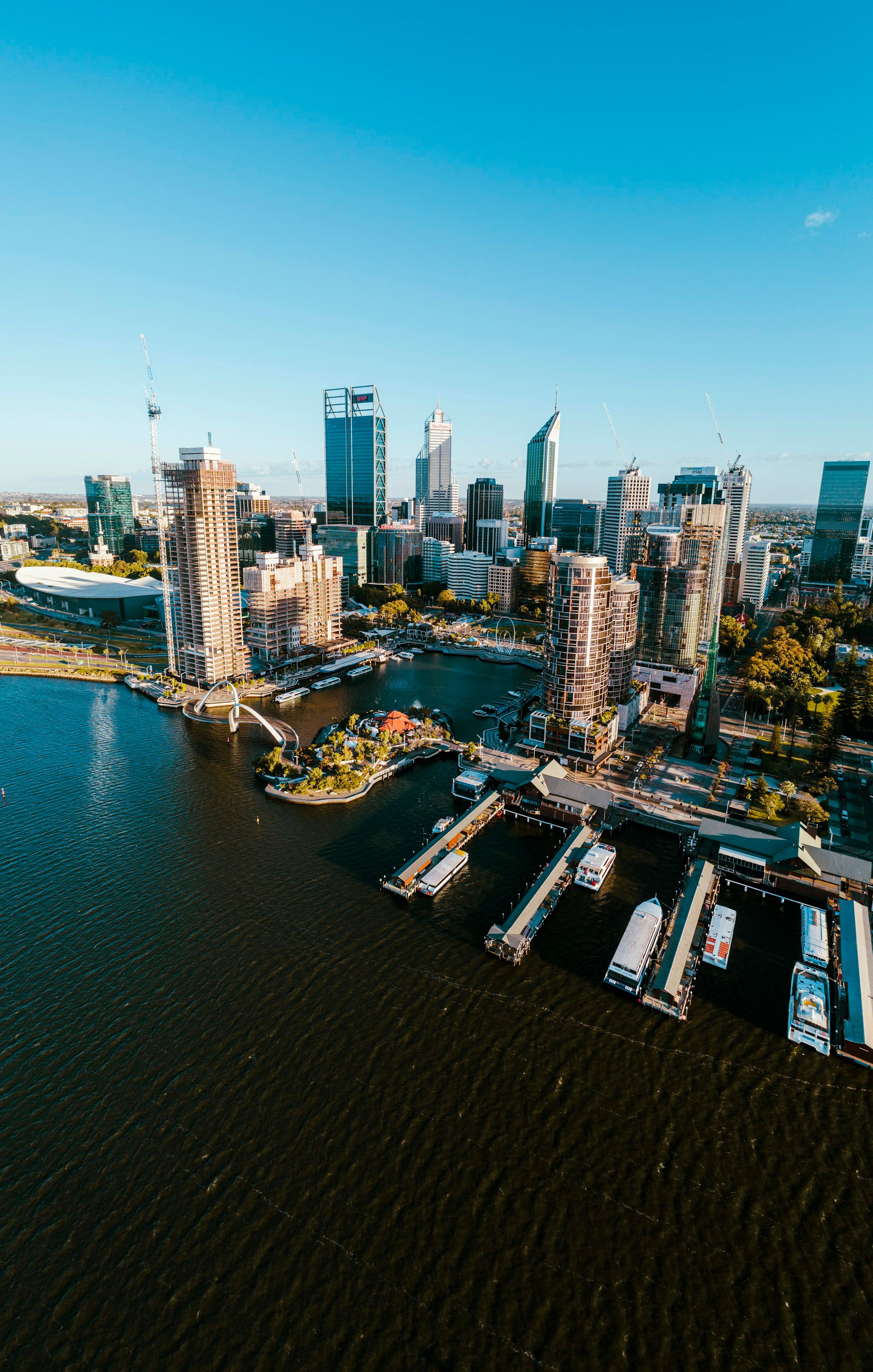 Aerial view of the Perth city skyline beside the Swan River in daytime